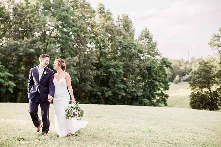 Walking hand-in-hand by Knoxville Wedding Photographer, Amanda May Photos.